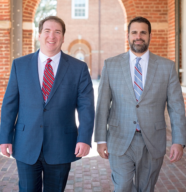 The attorneys at The Gordon Law firm walking near the courtroom